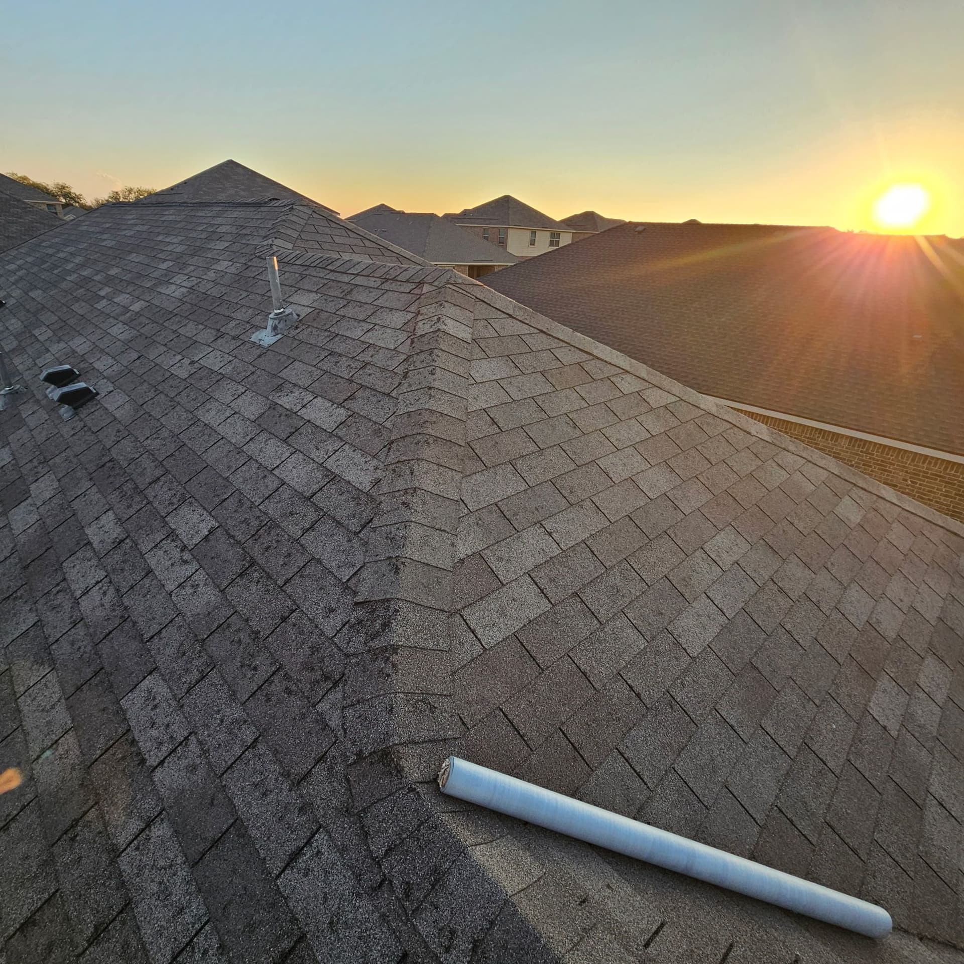 Providing Emergency Tarping Services Under a Beautiful Sunset in Sanger image