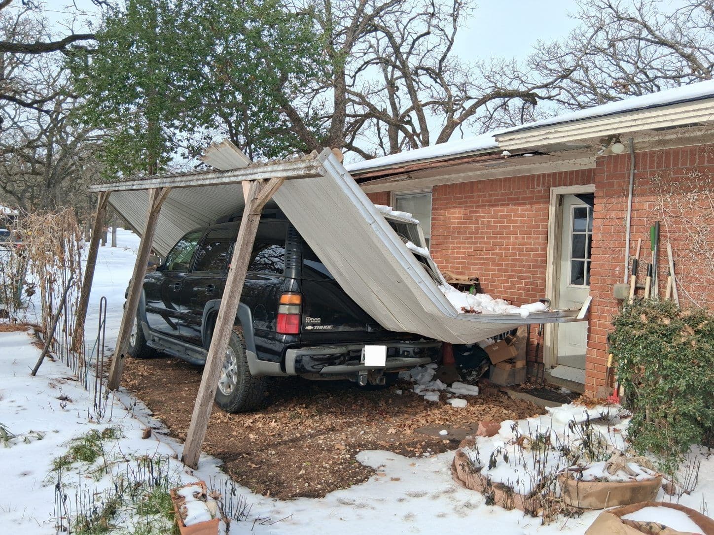 Dealing with Winter Storm Damage - Roof and Driveway Cover Repair